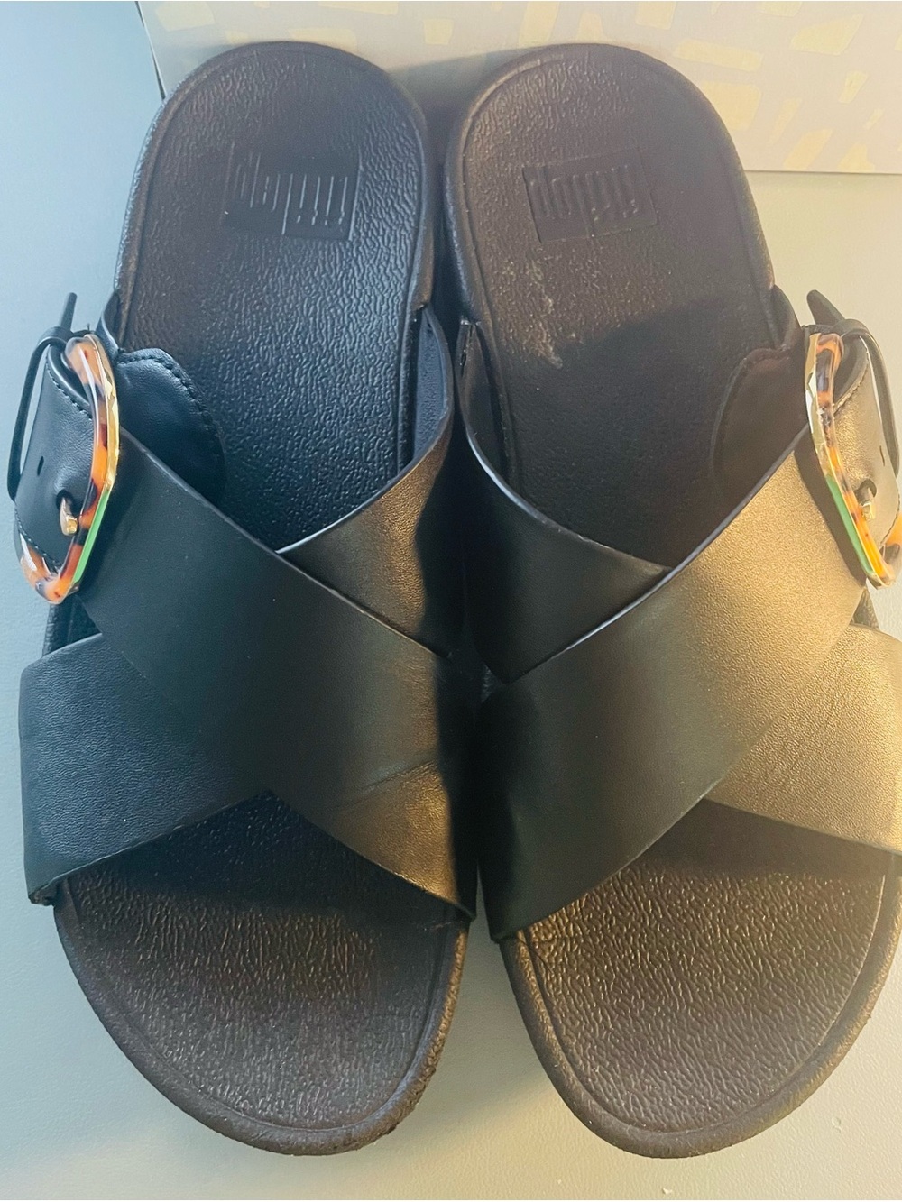 FitFlop Black Crisscross Slide Sandals with Tortoiseshell Buckle. LULU